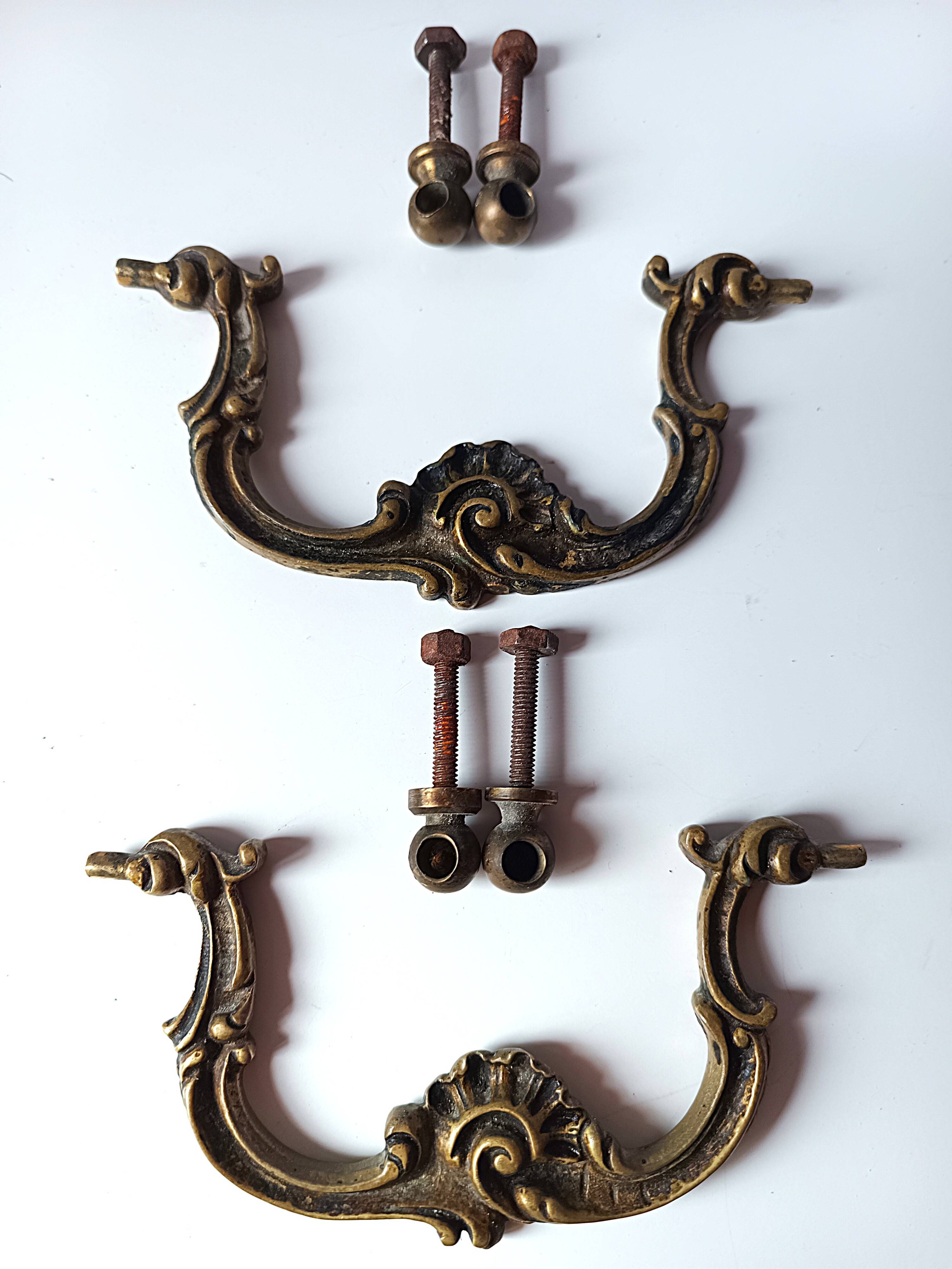 Antique pair of bronze drawer handles.