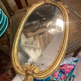 Oval mirror in gilded wood