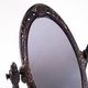 Art Nouveau table mirror with ornamental metal frame, early 20th century