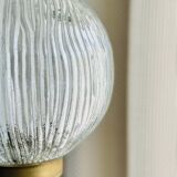 Floor lamp in gilded brass and round glass globe