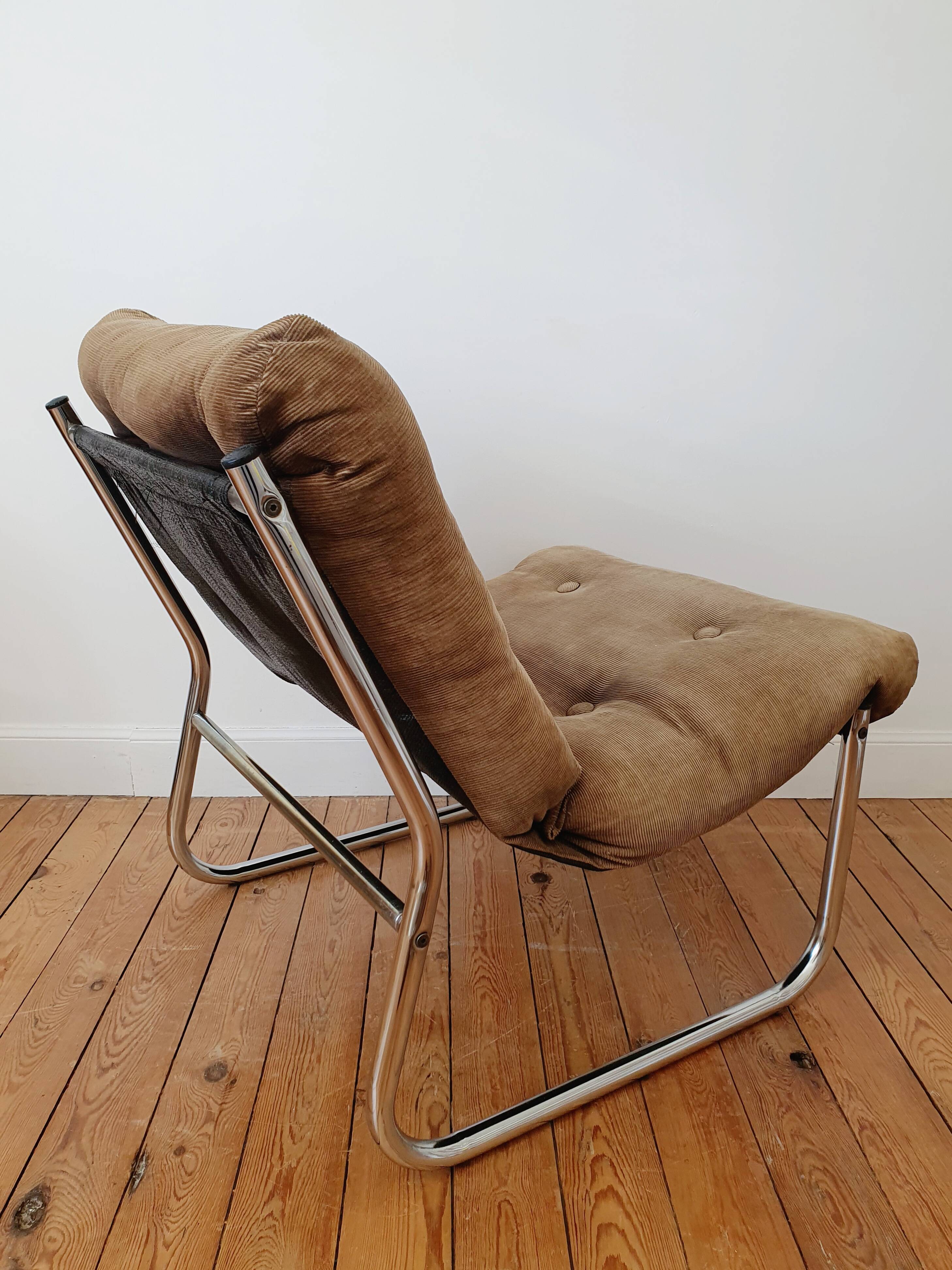 Vintage tubular chrome and velvet armchair