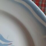 Old mismatched earthenware dinner plates accompanied by a deep dish