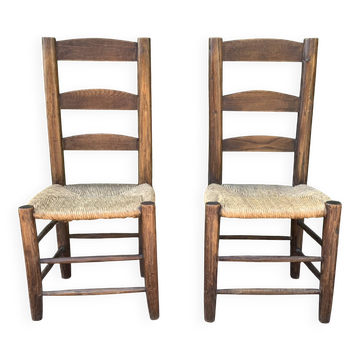 Pair of handcrafted rush chairs in solid oak.
