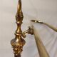 Old golden brass towel rack on baroque style foot