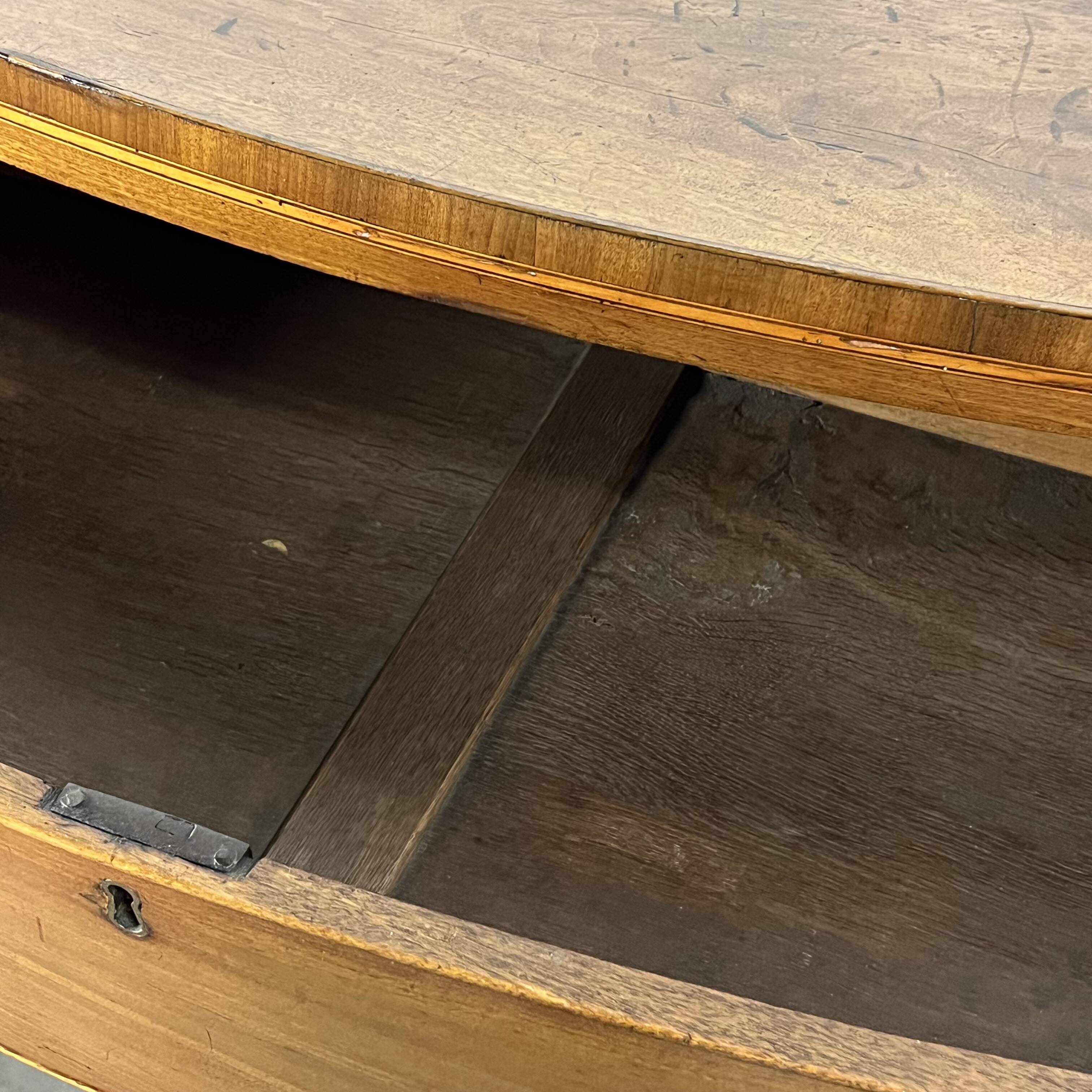 English commode from the George III Regency period, bombe shape in mahogany veneer.