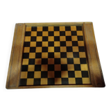 old wooden game board: small horses and checkers