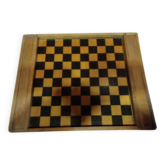 old wooden game board: small horses and checkers