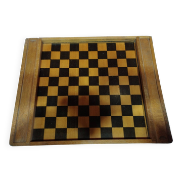 old wooden game board: small horses and checkers