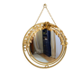 Vintage round illuminated mirror in gold metal with rose decoration.