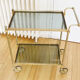 Glass and gold metal wheeled serving table 1960