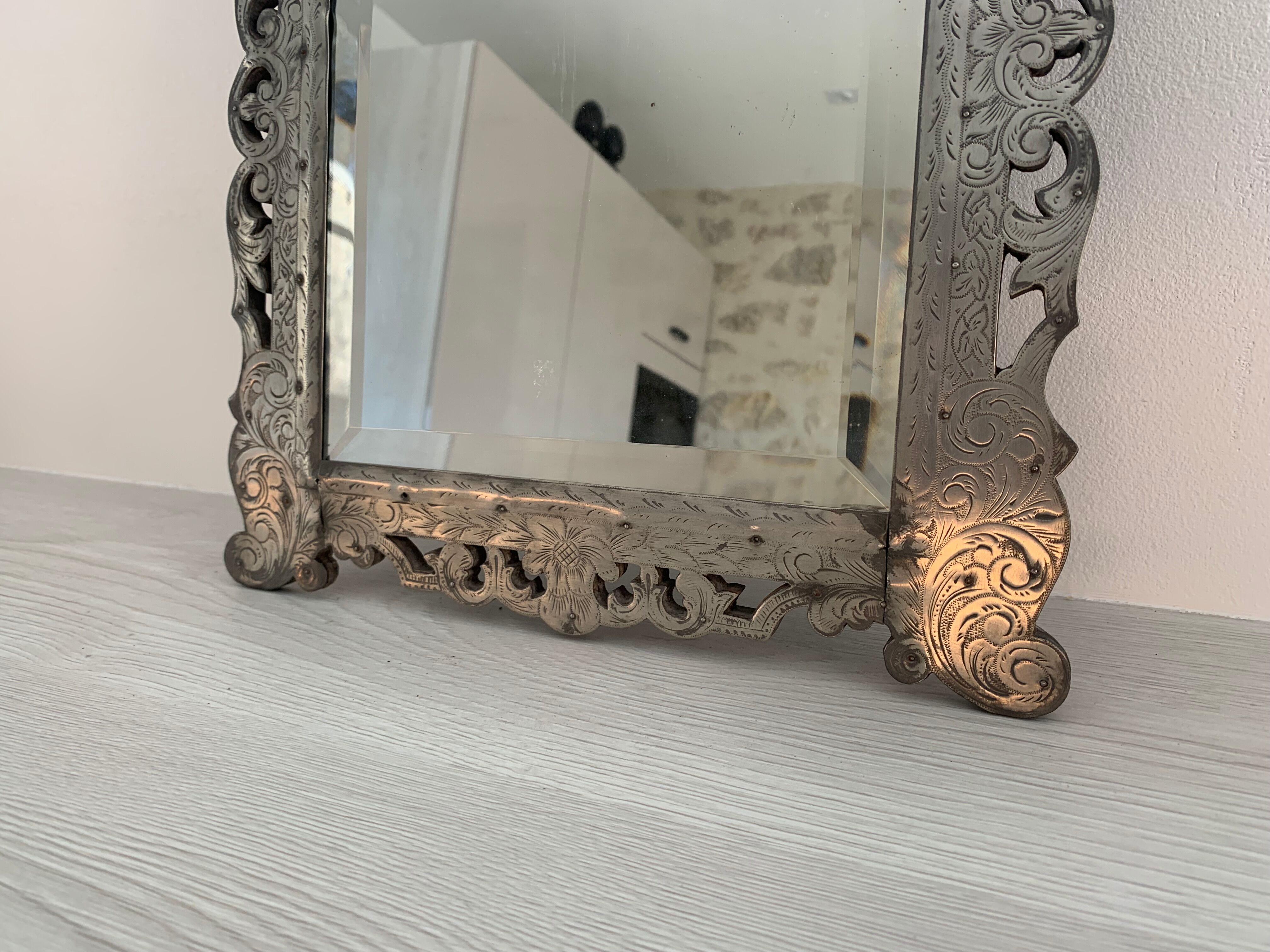 Eventful beveled mirror and openwork period 1900 repelled tin decoration