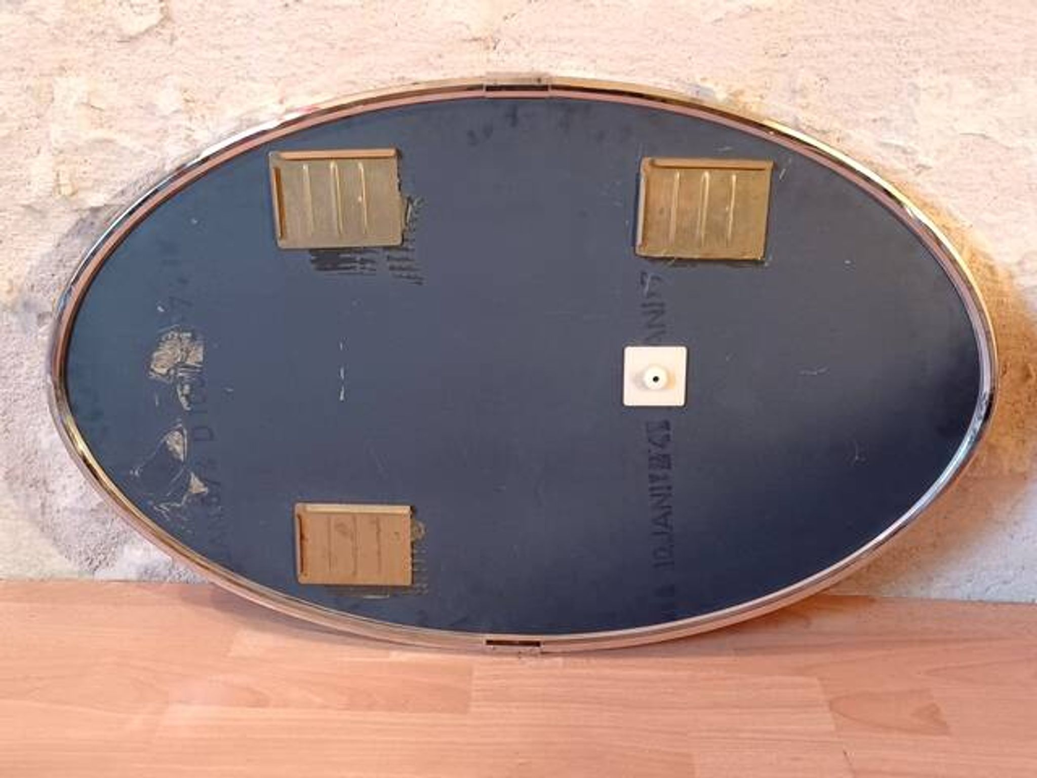 Oval Art Deco mirror with vintage chrome frame from the 1970s.