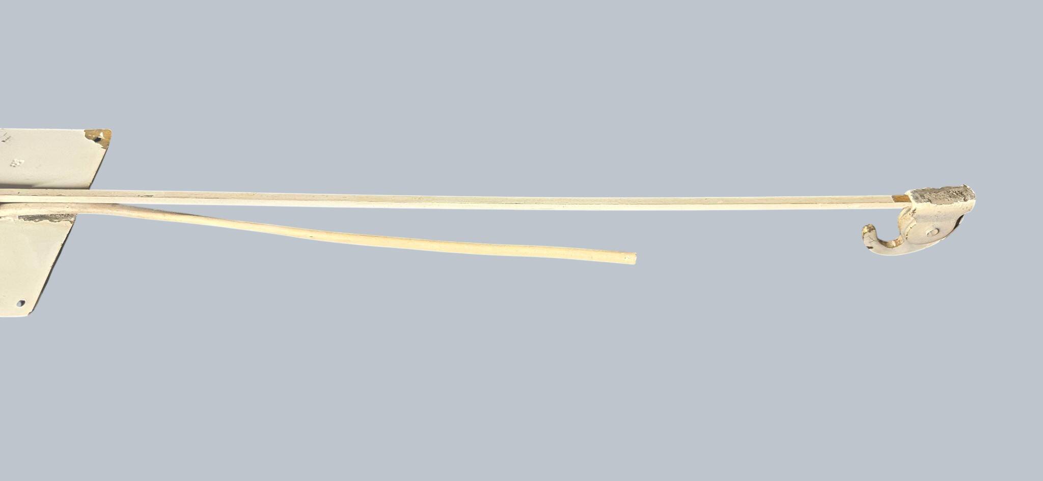 Minimalist metal wall light in the style of Jean Prouvé, circa 1950.