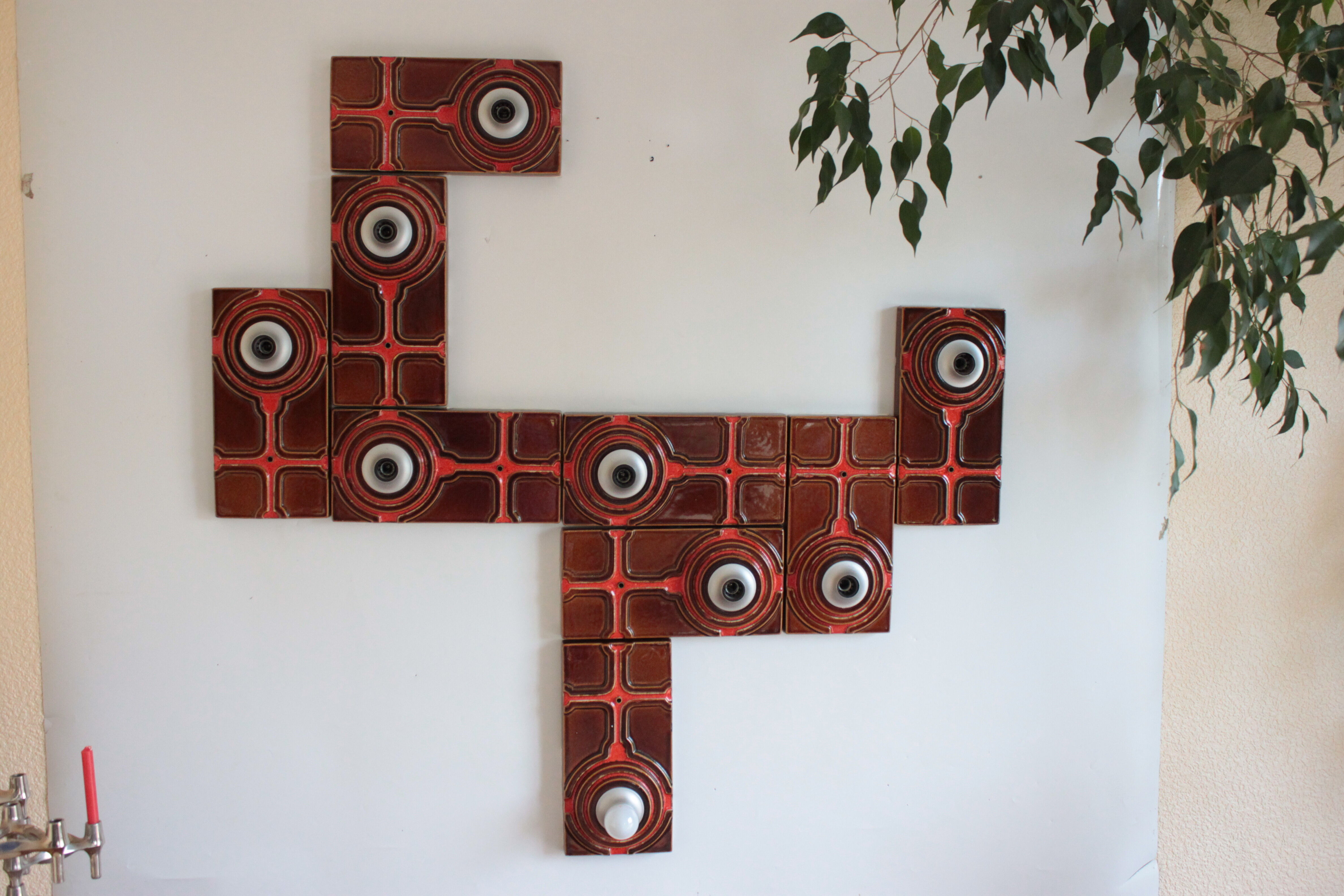 Serie de 9 appliques sculpturales des années 60 en céramique
