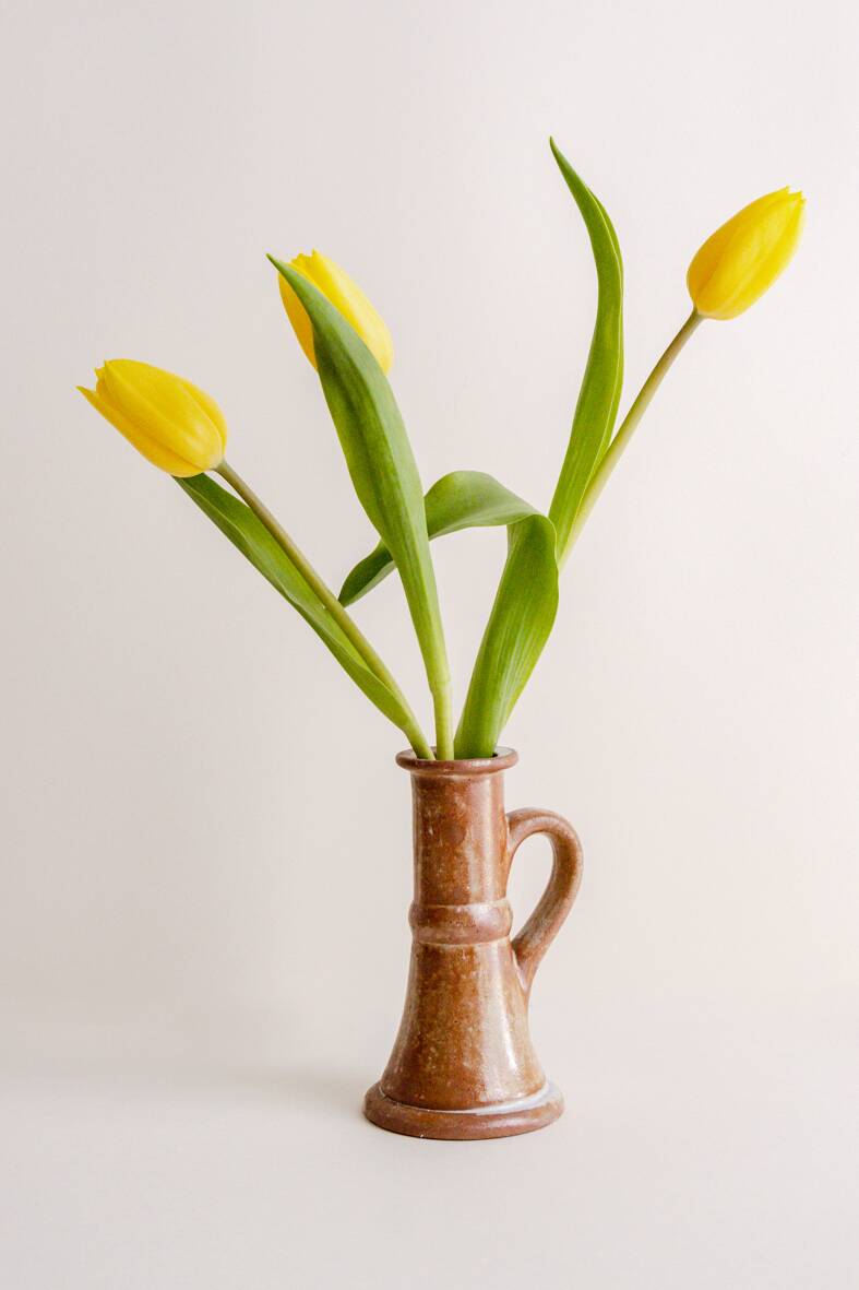Set of two terracotta candle holders.