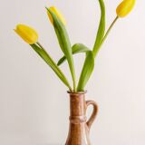 Set of two terracotta candle holders.