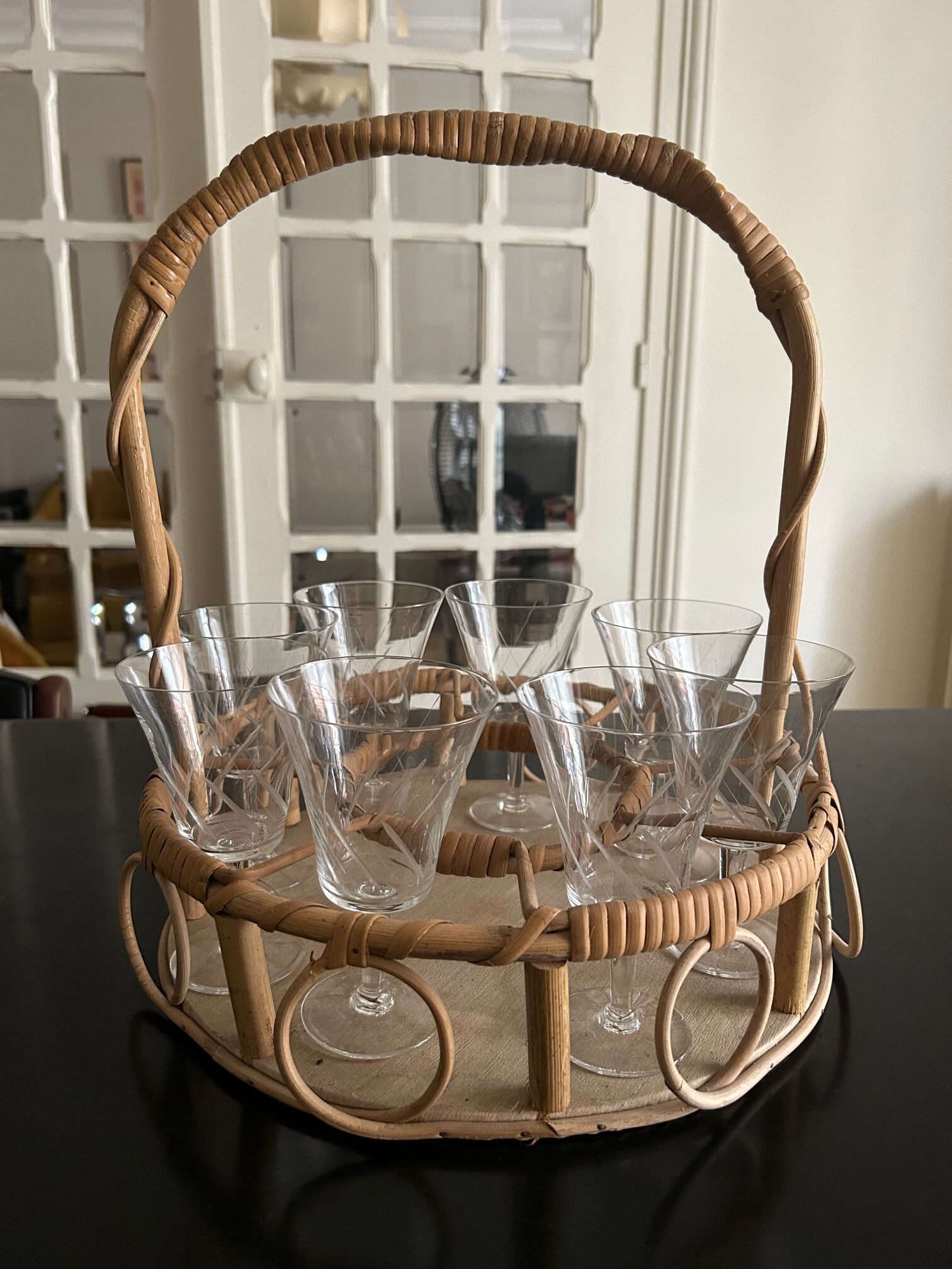 Wicker basket and 8 antique glasses