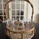 Wicker basket and 8 antique glasses
