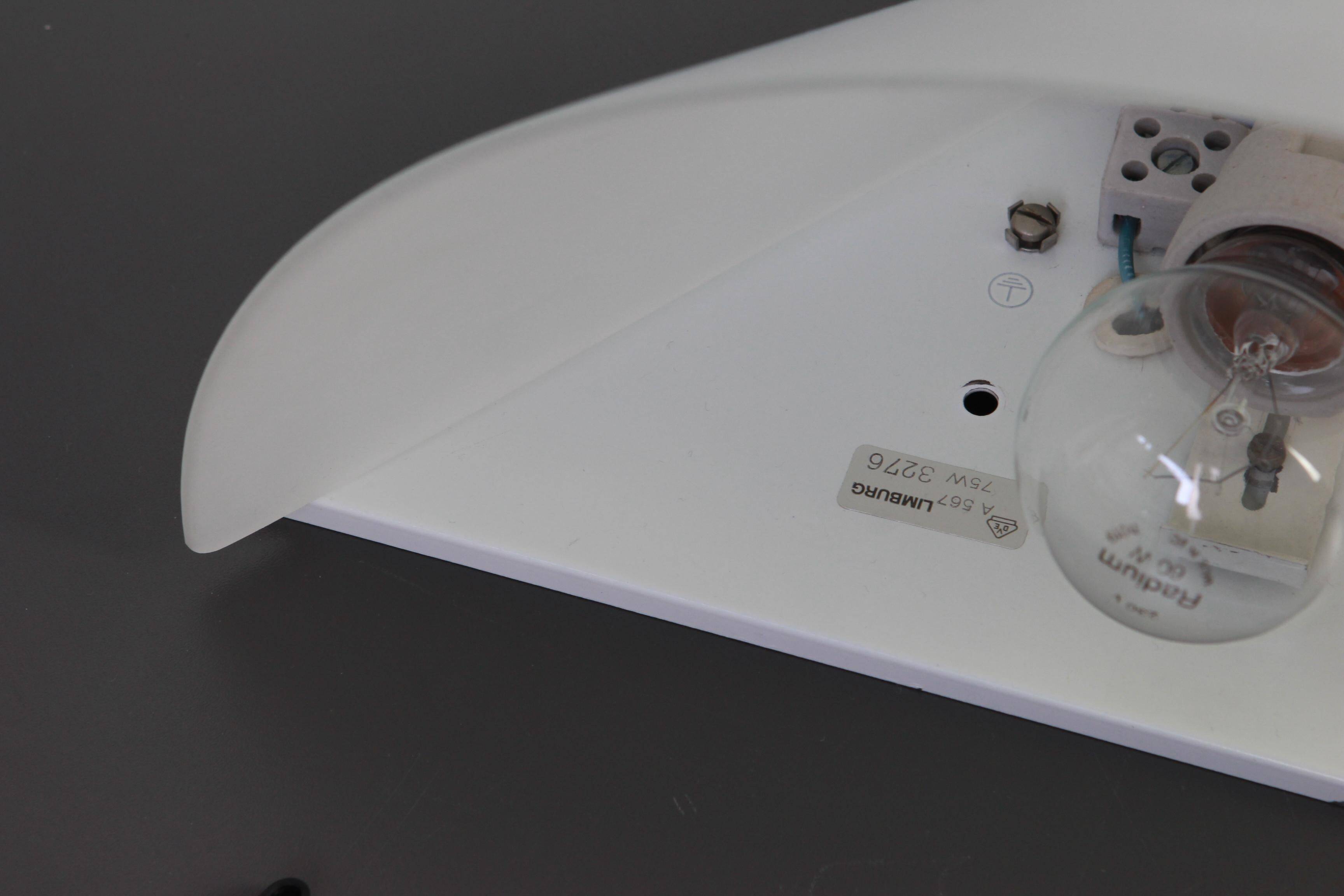 Pair of opaline glass wall lights designed by Limburg, Germany.