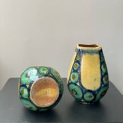 A pair of green and yellow vases