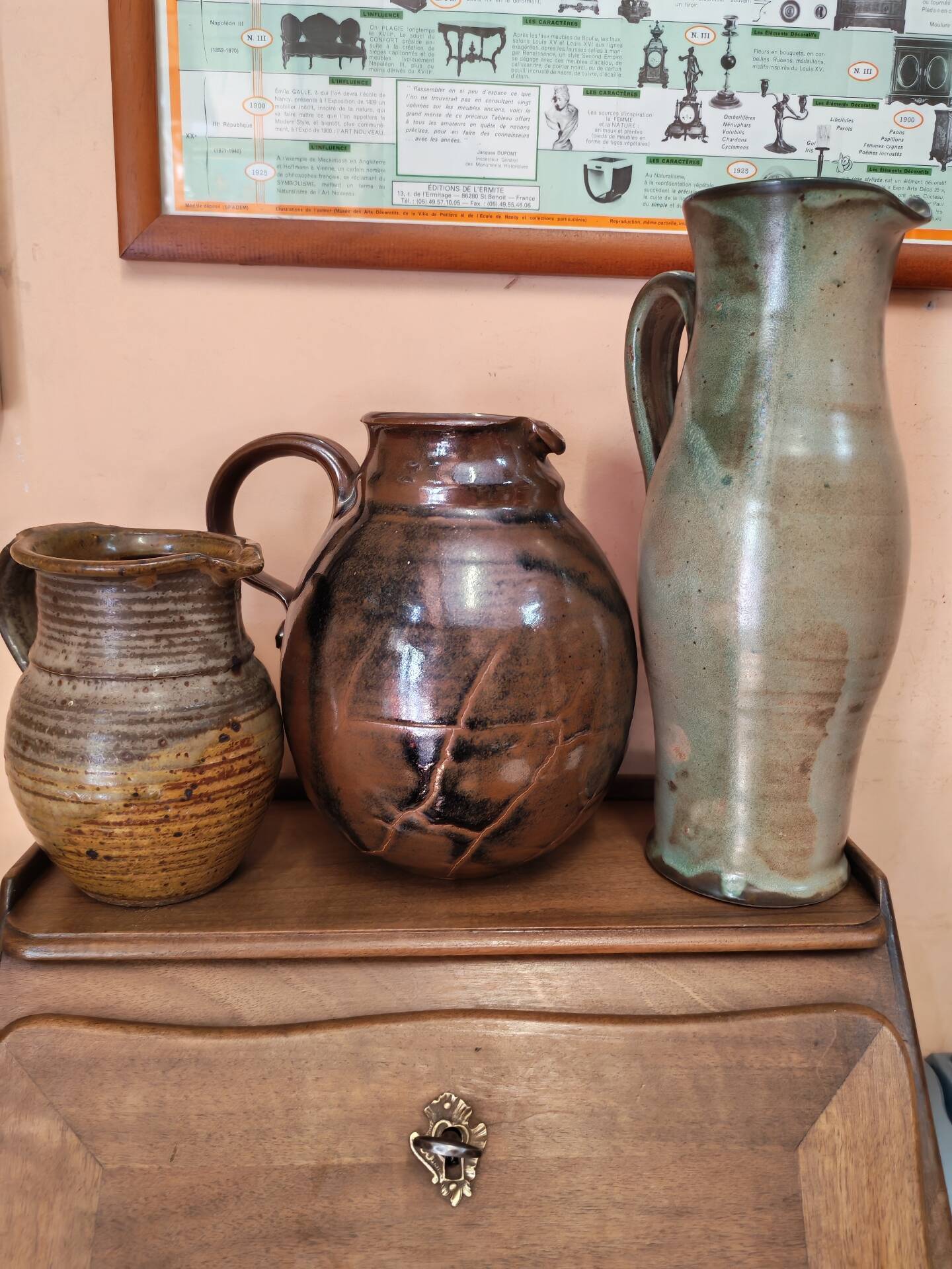 Set of three vintage ceramic jugs and a pitcher.