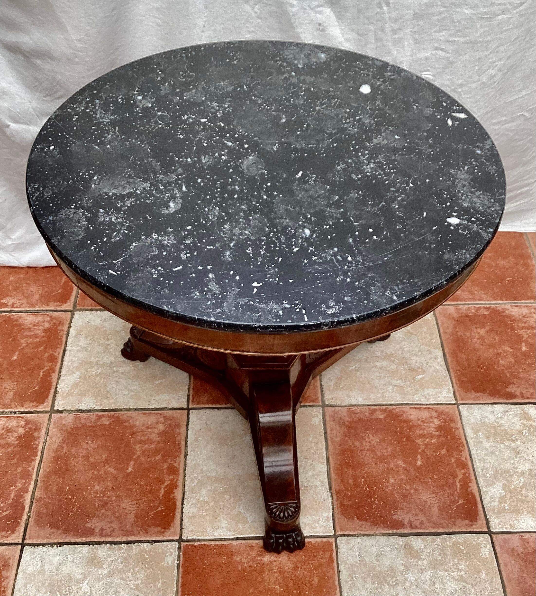 Old pedestal table in oak wood with marble