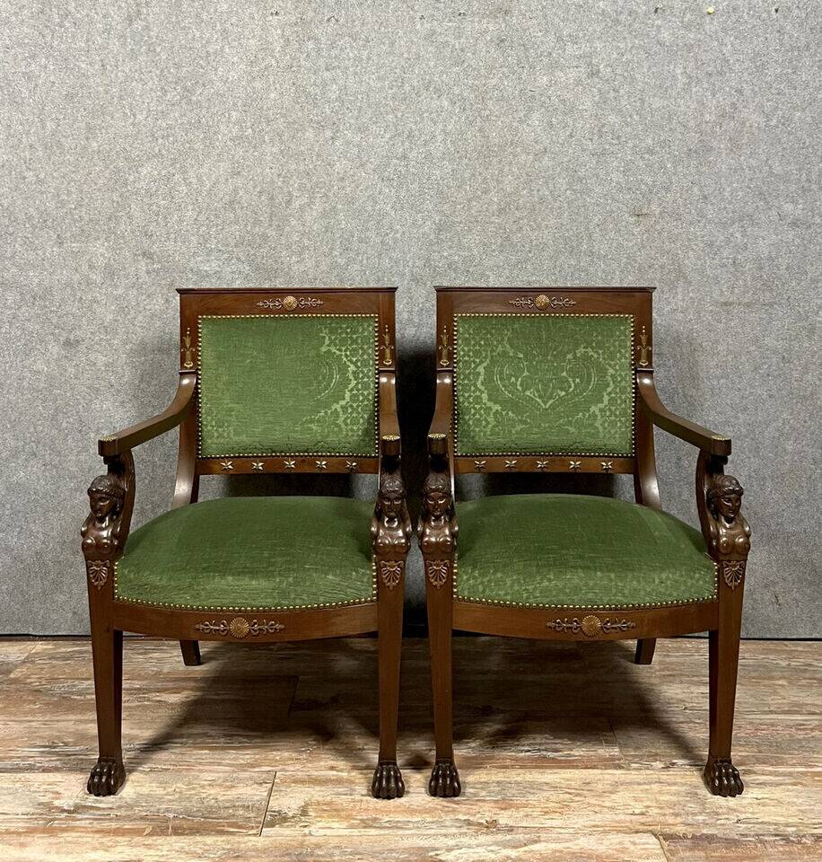 Pair of Empire-Consulate armchairs in molded and carved mahogany