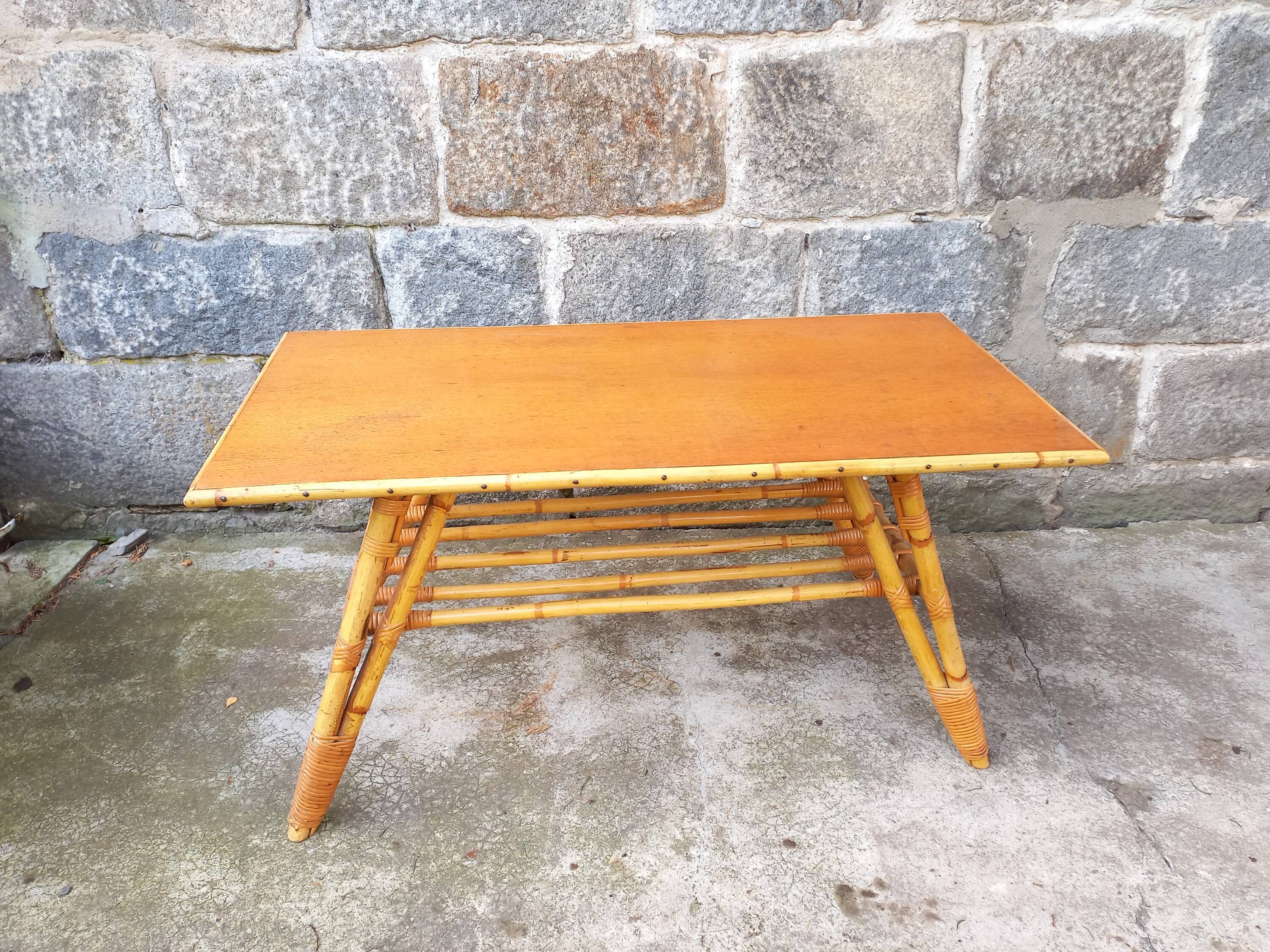 Rattan coffee table with compass legs