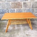 Rattan coffee table with compass legs