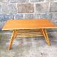 Rattan coffee table with compass legs