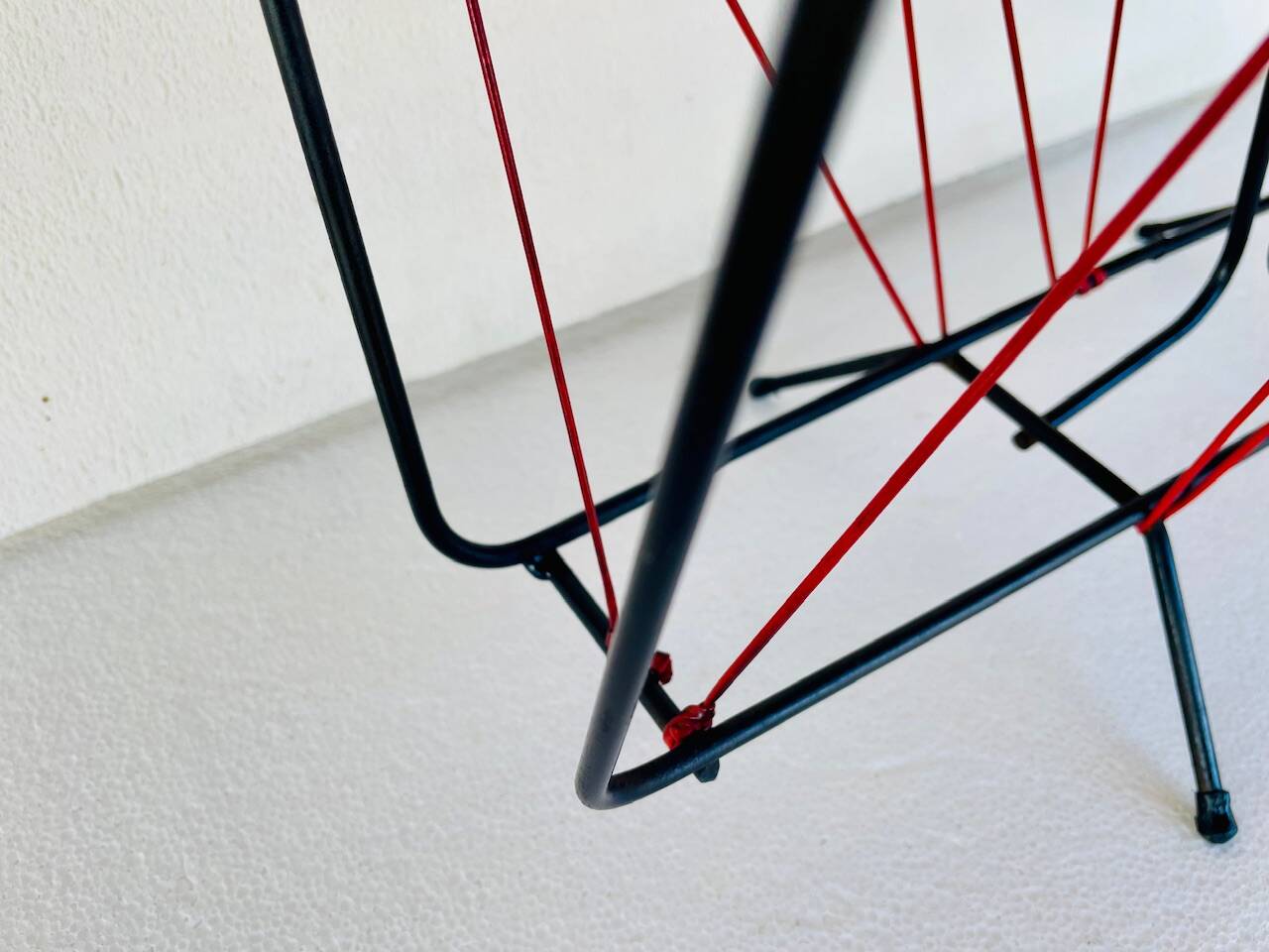 Vintage black metal magazine rack circa 19