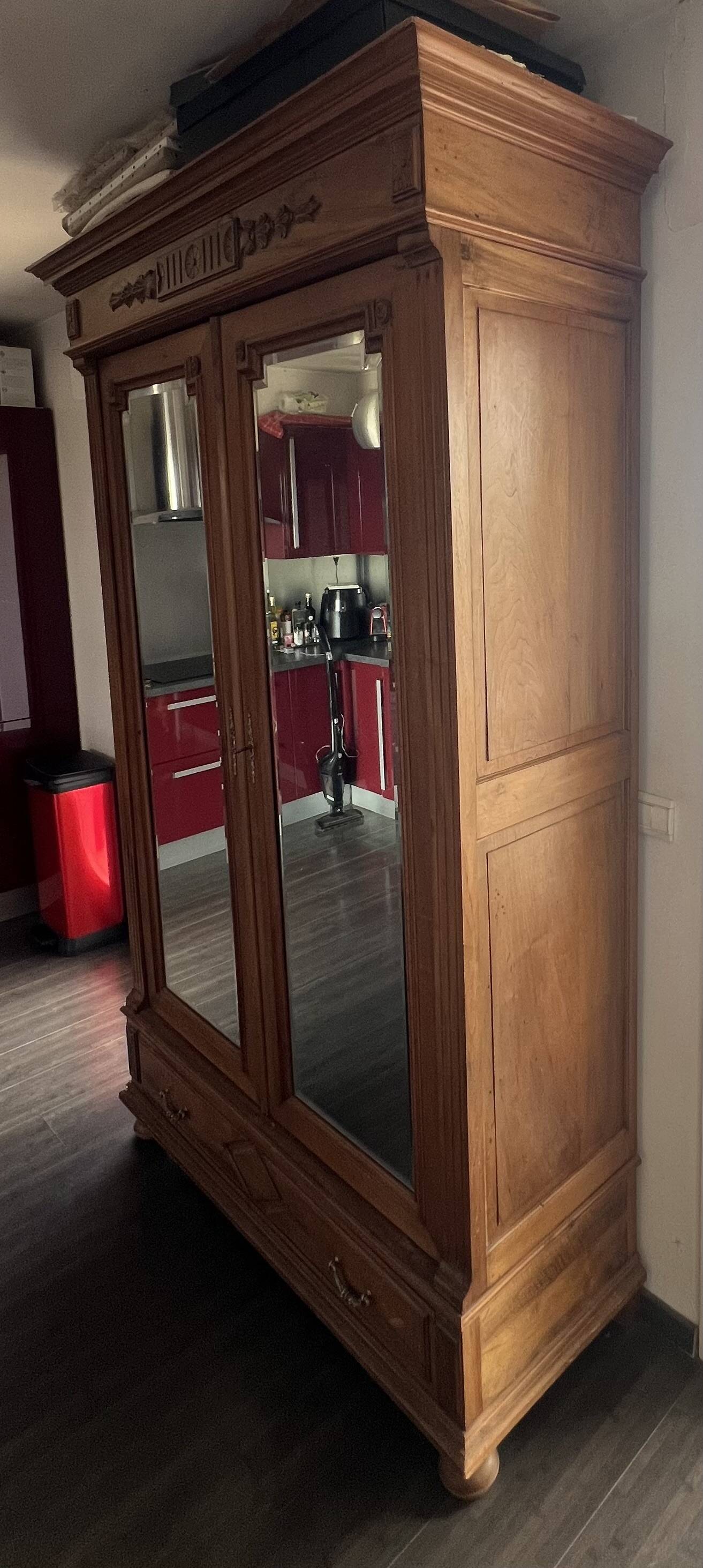 Walnut wardrobe with mirror doors.