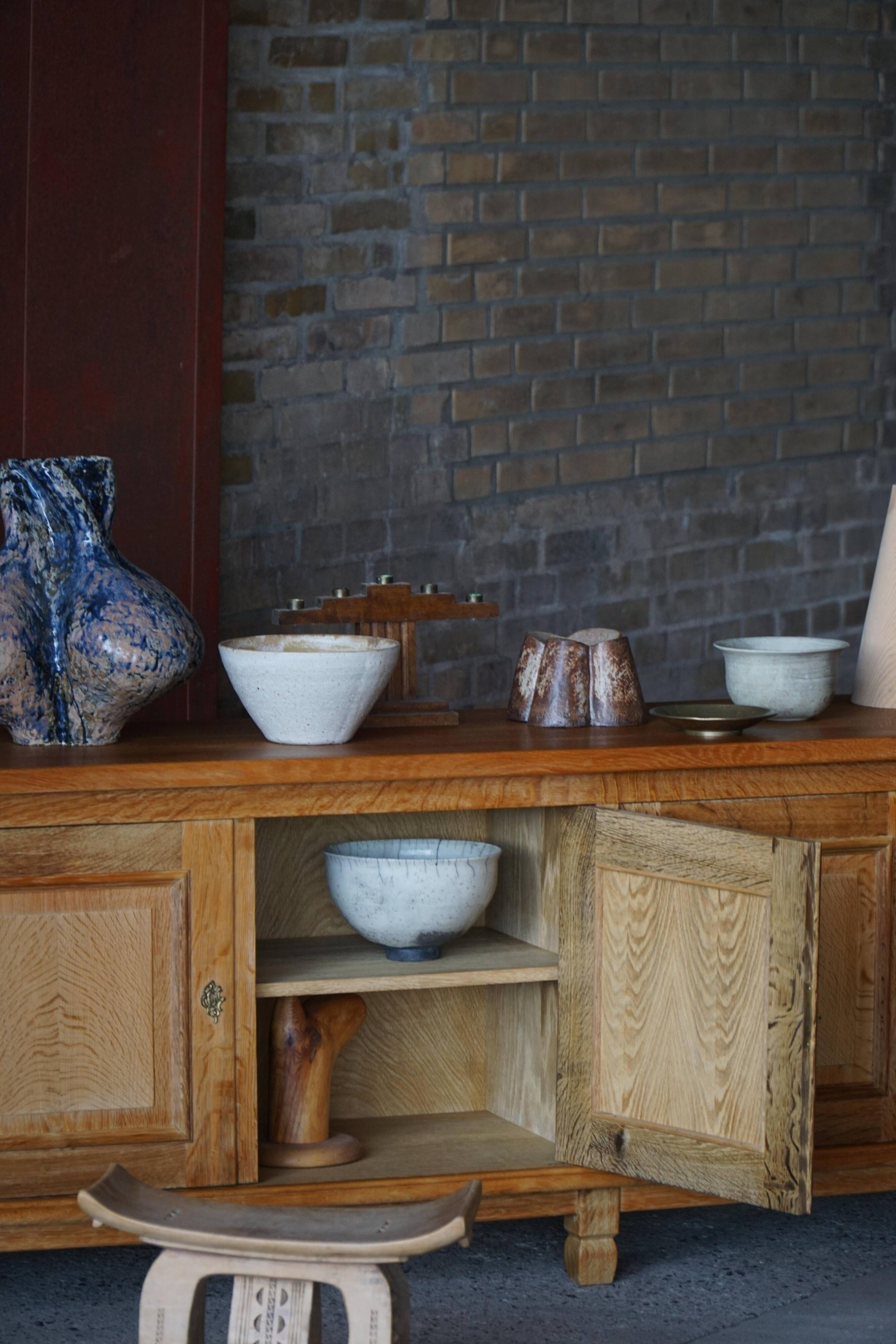 Modern Danish low enfilade in oak with panelled doors, mid-20th century.