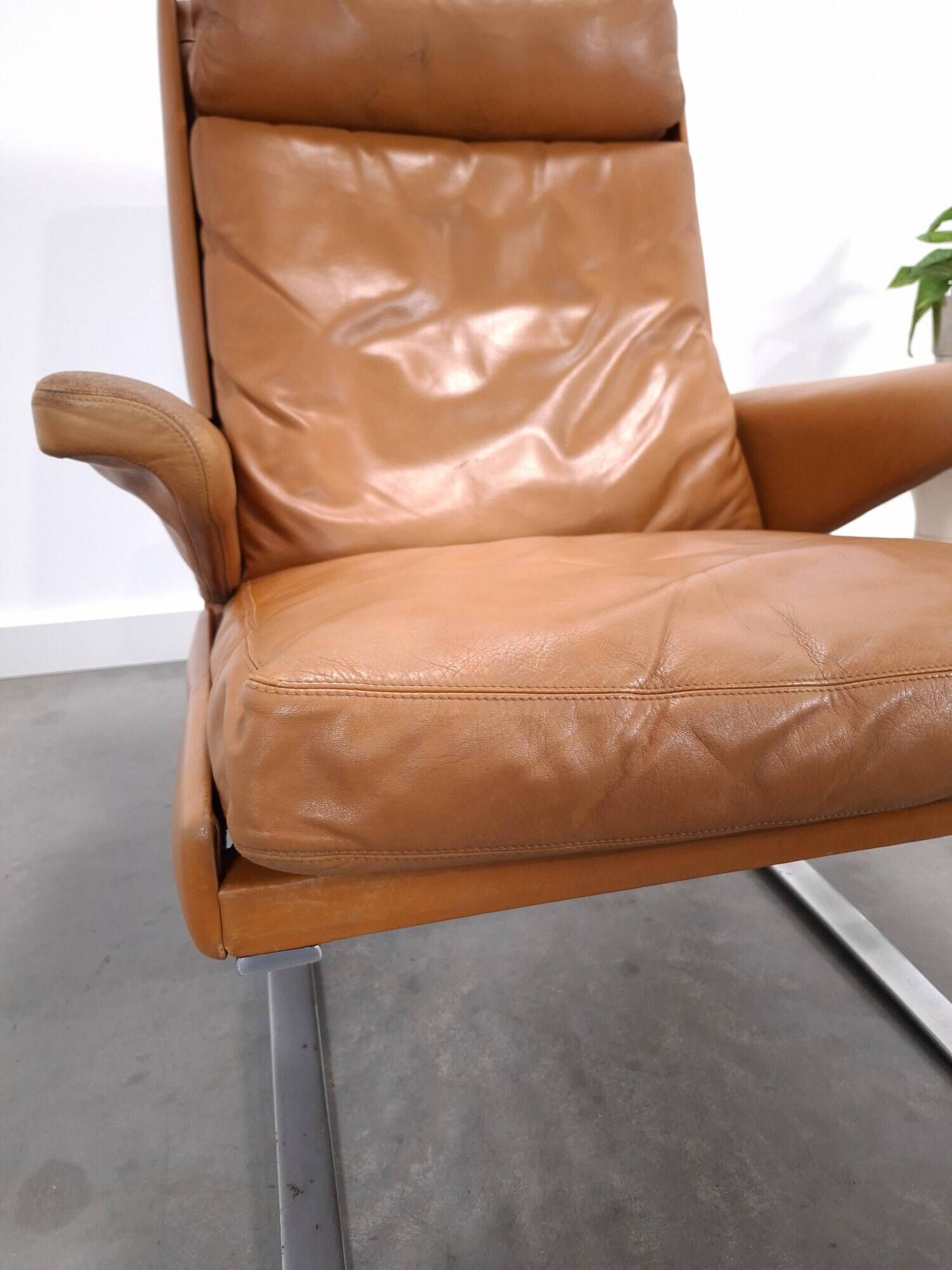 Vintage COR Swing armchair with ottoman, Reinhold Adolf, cognac leather