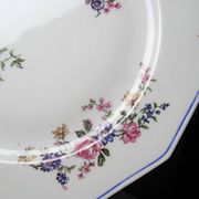 4 flat plates by Bernardaud, Limoges porcelain, floral decoration from the 1920s to 1950s.