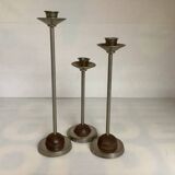 Trio of metal and wood candlesticks