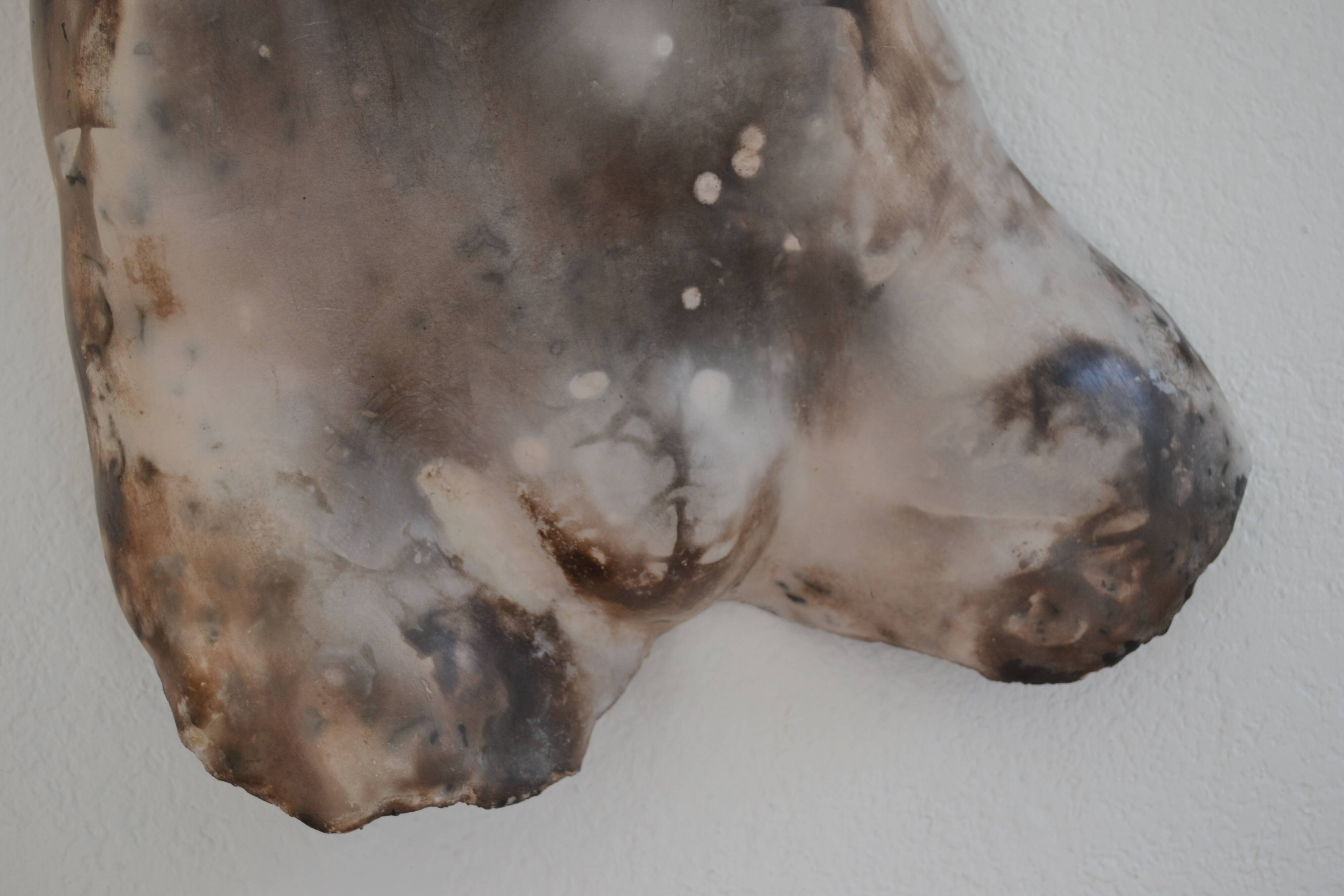 Male torso sculpture by patinated casting, signed to be identified.