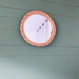 Round mirror in vintage wicker