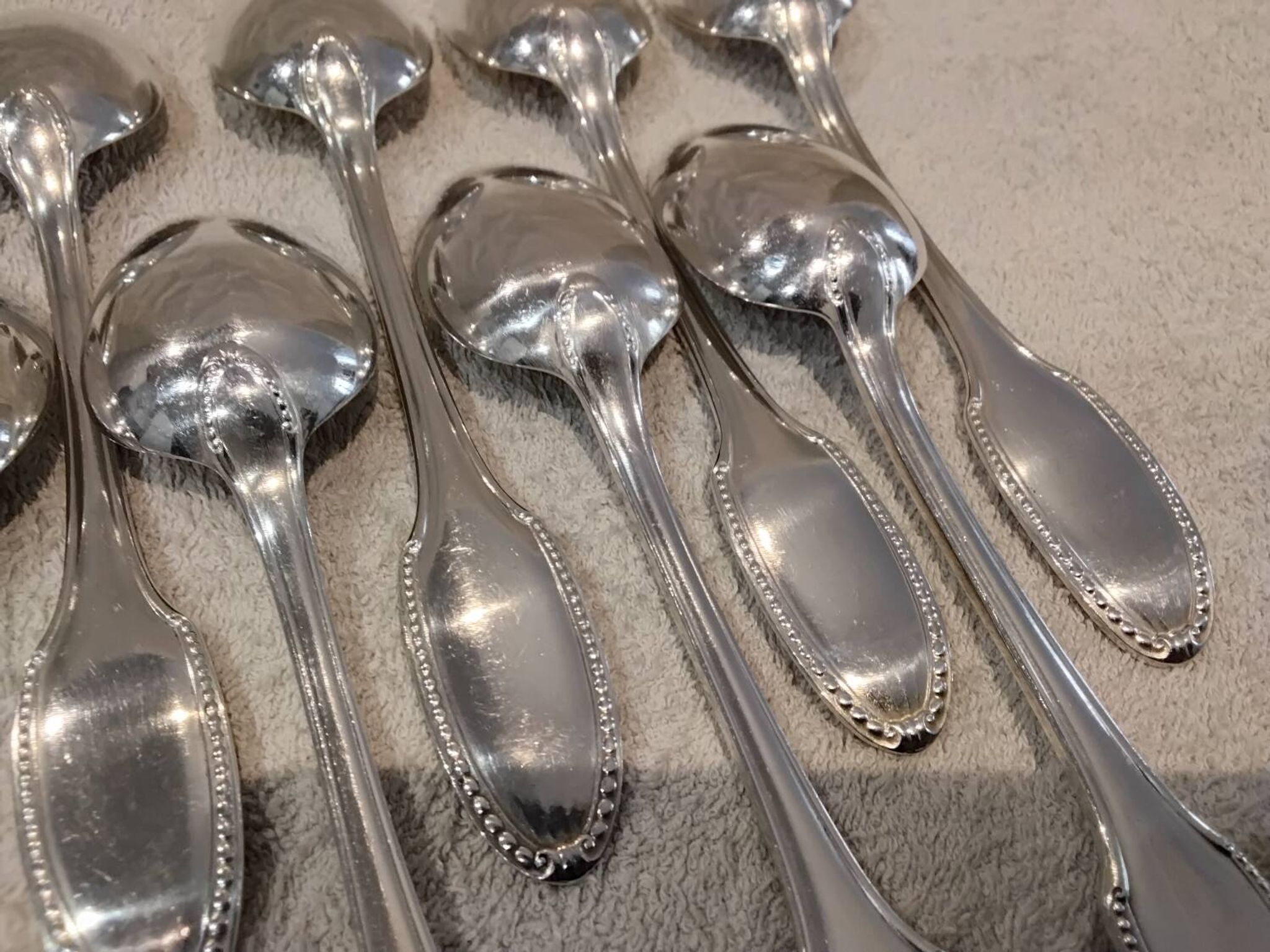 12 silver plated dessert spoons, goldsmith Alfenide, St LXVI pearls