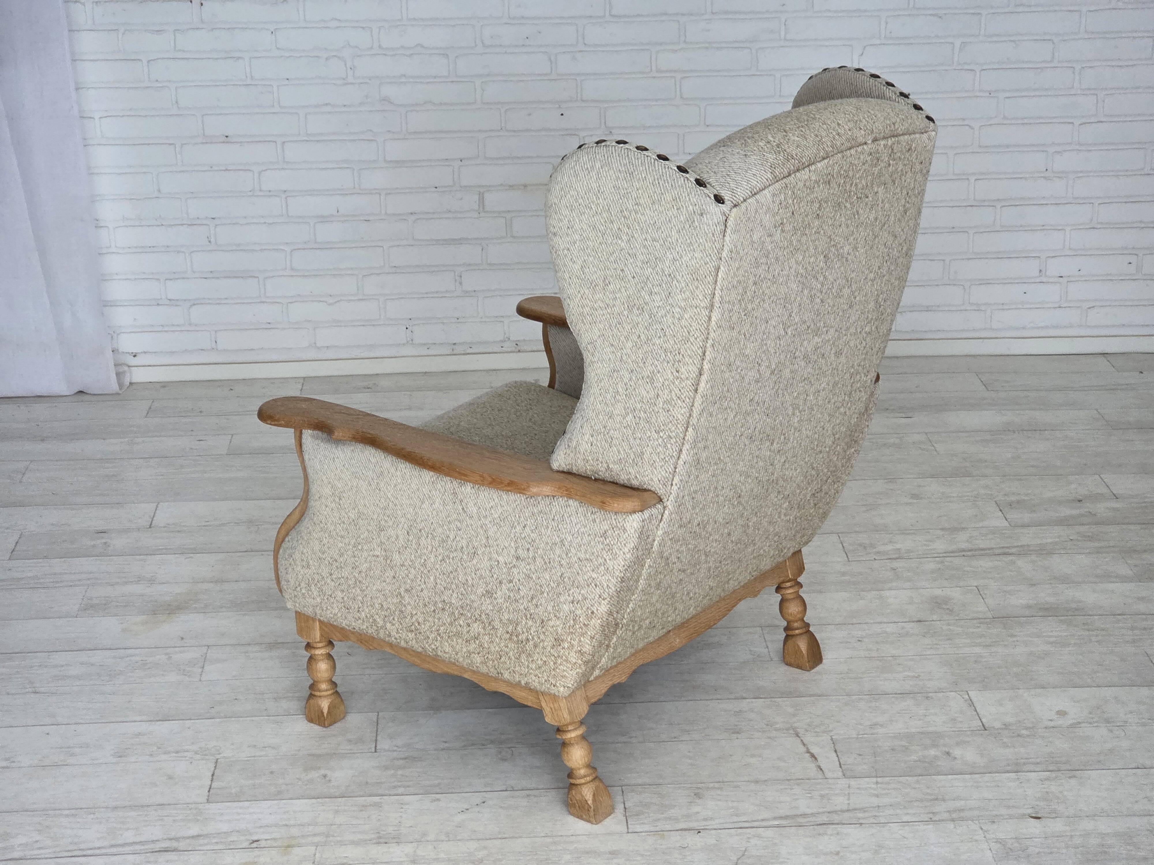 1970s, Danish highback armchair, furniture wool, solid oak wood.