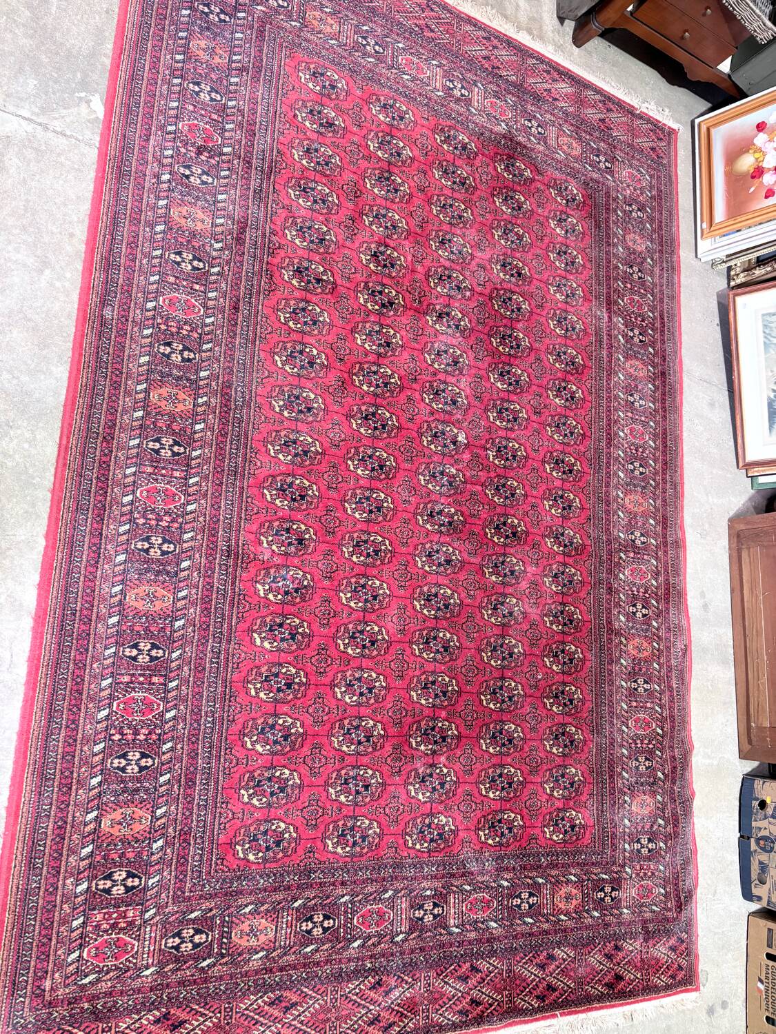 Large red Bokhara-style oriental carpet 300x200 cm with gul patterns.