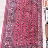 Large red Bokhara-style oriental carpet 300x200 cm with gul patterns.