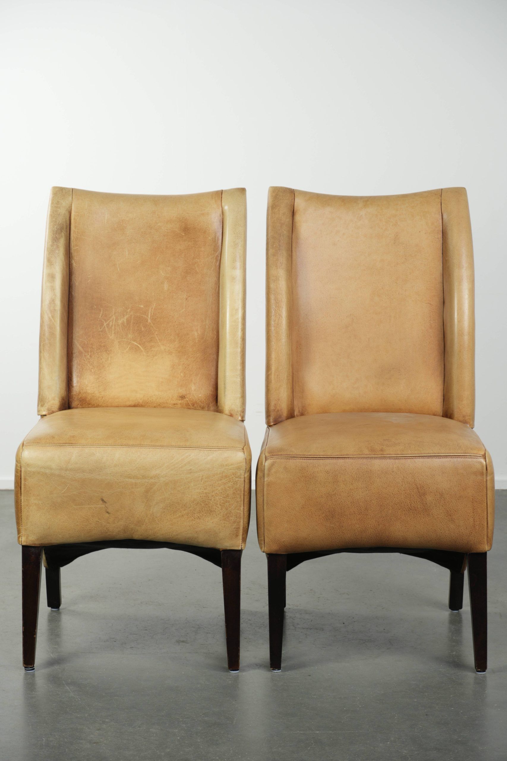Set of six cowhide dining chairs with a comfortable seat and high back