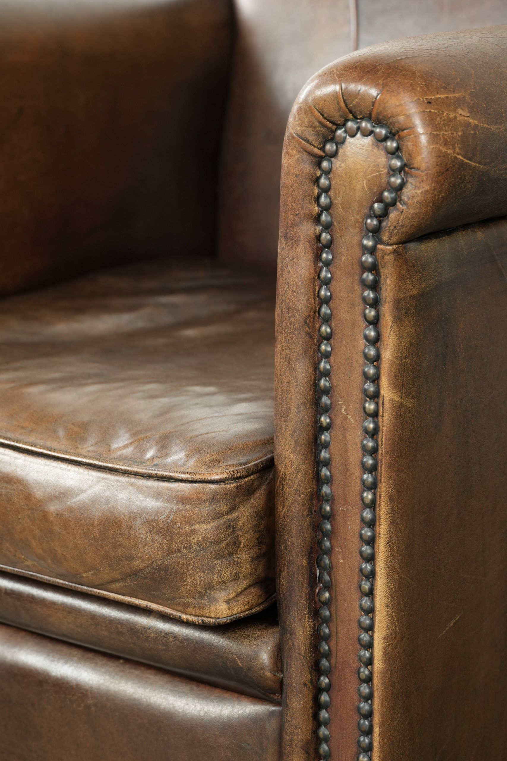 Armchair / lounge chair made of sheepskin leather with characterful patina