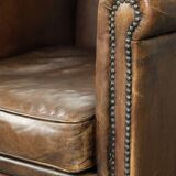 Armchair / lounge chair made of sheepskin leather with characterful patina