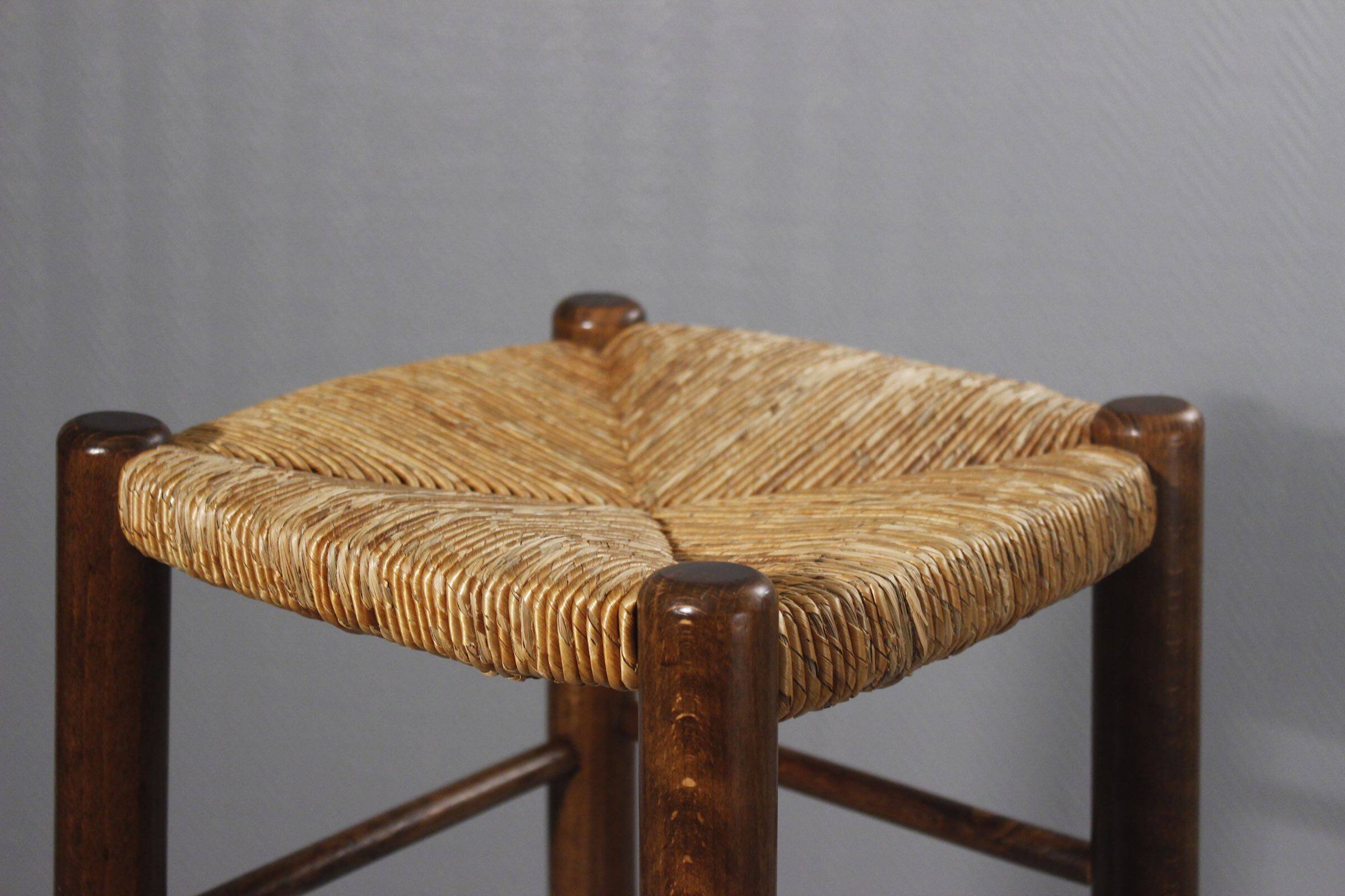 Vintage straw stool in the style of Charlotte Perriand, 1970s.