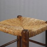 Vintage straw stool in the style of Charlotte Perriand, 1970s.