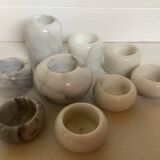 9 marble candle holders of different sizes