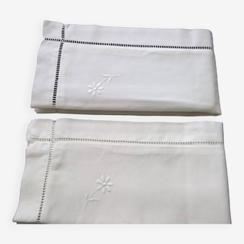 Pair of pillowcases with embroidery and openings
