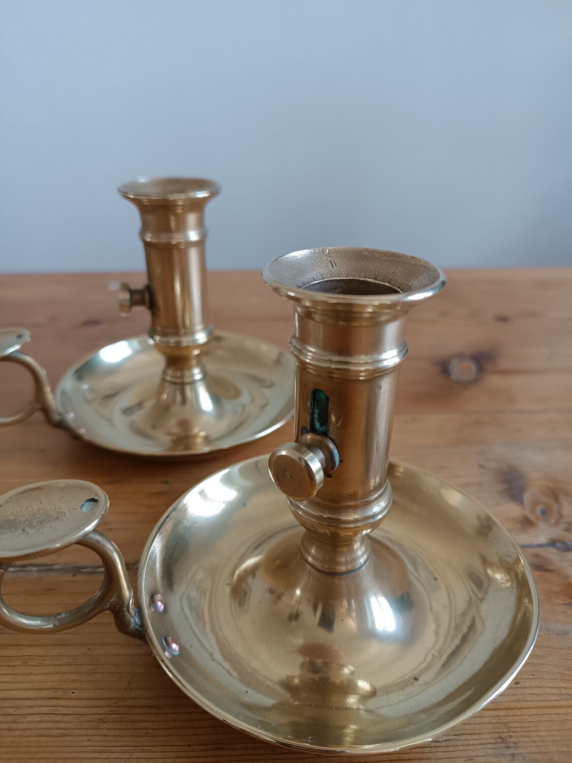 Duo of gilded brass cellar rat candlesticks